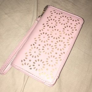 A pink and gold wallet